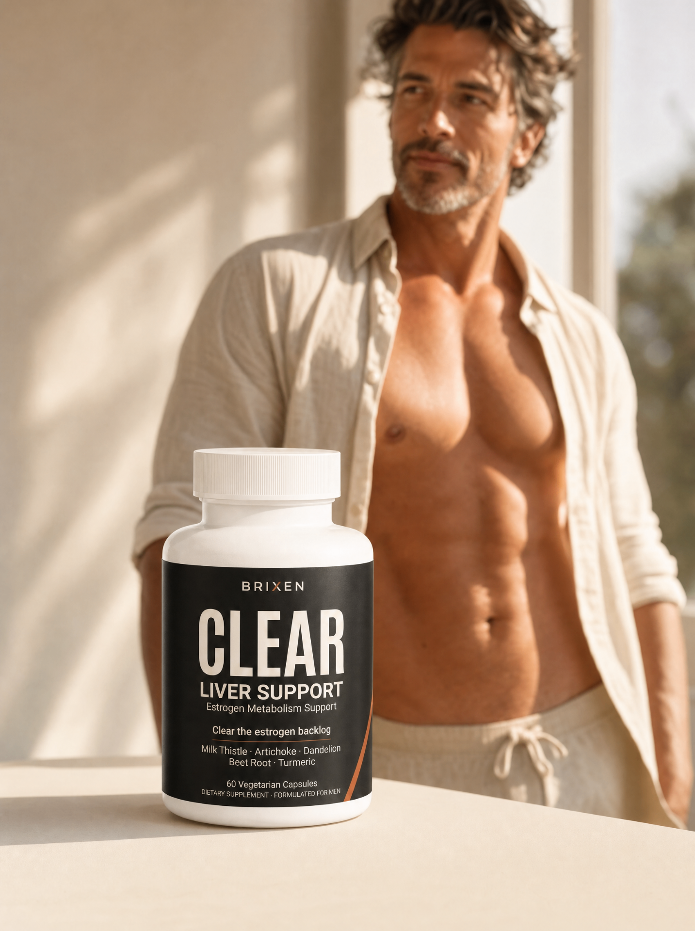Lean man with open shirt next to Brixen Clear bottle